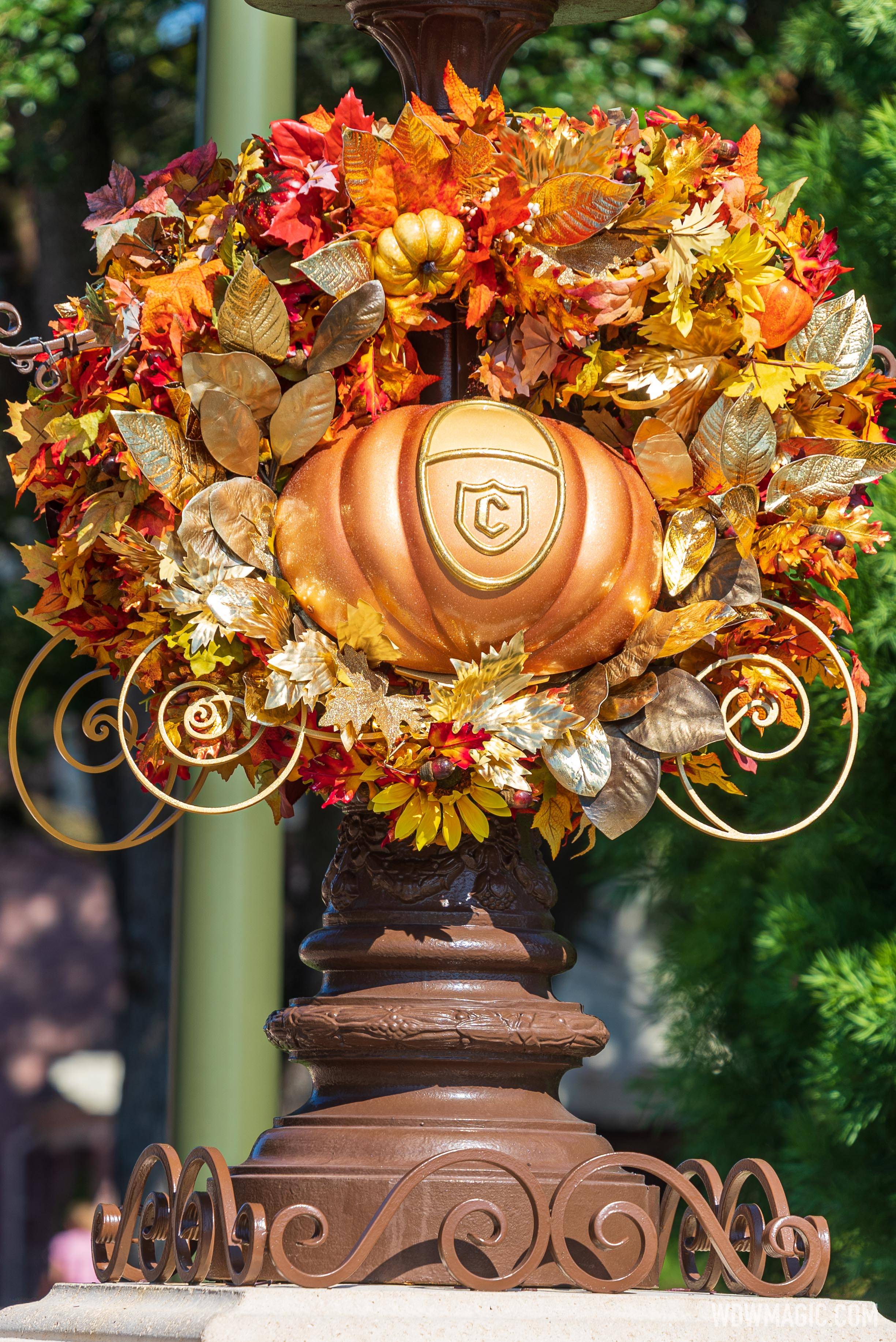 Cinderella Coach pumpkin wreaths in the hub at Magic Kingdom